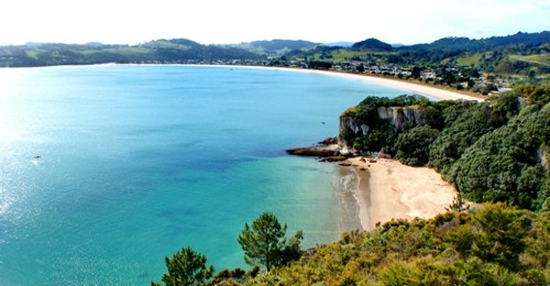Lonely Bay with Cooks Beach in the background